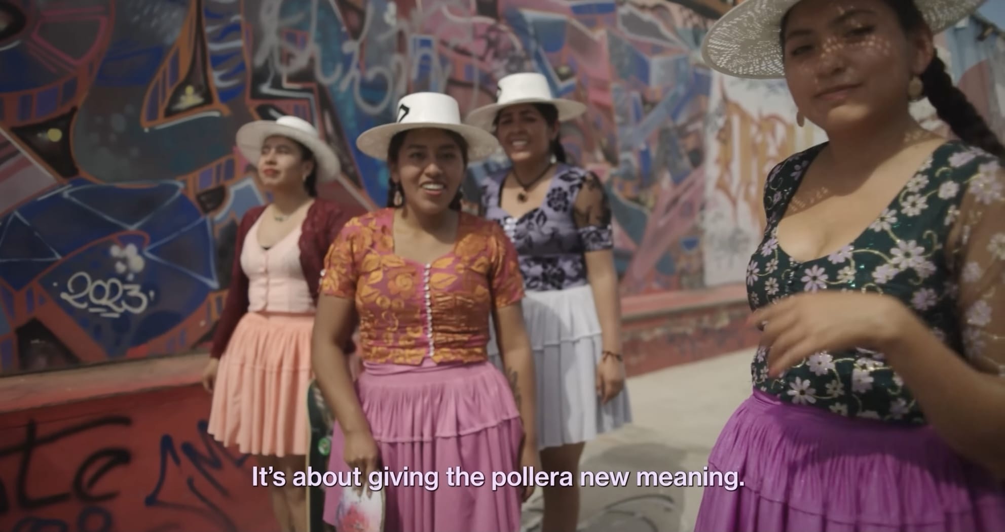 a still from a documentary showing Quechuan women skateboarding