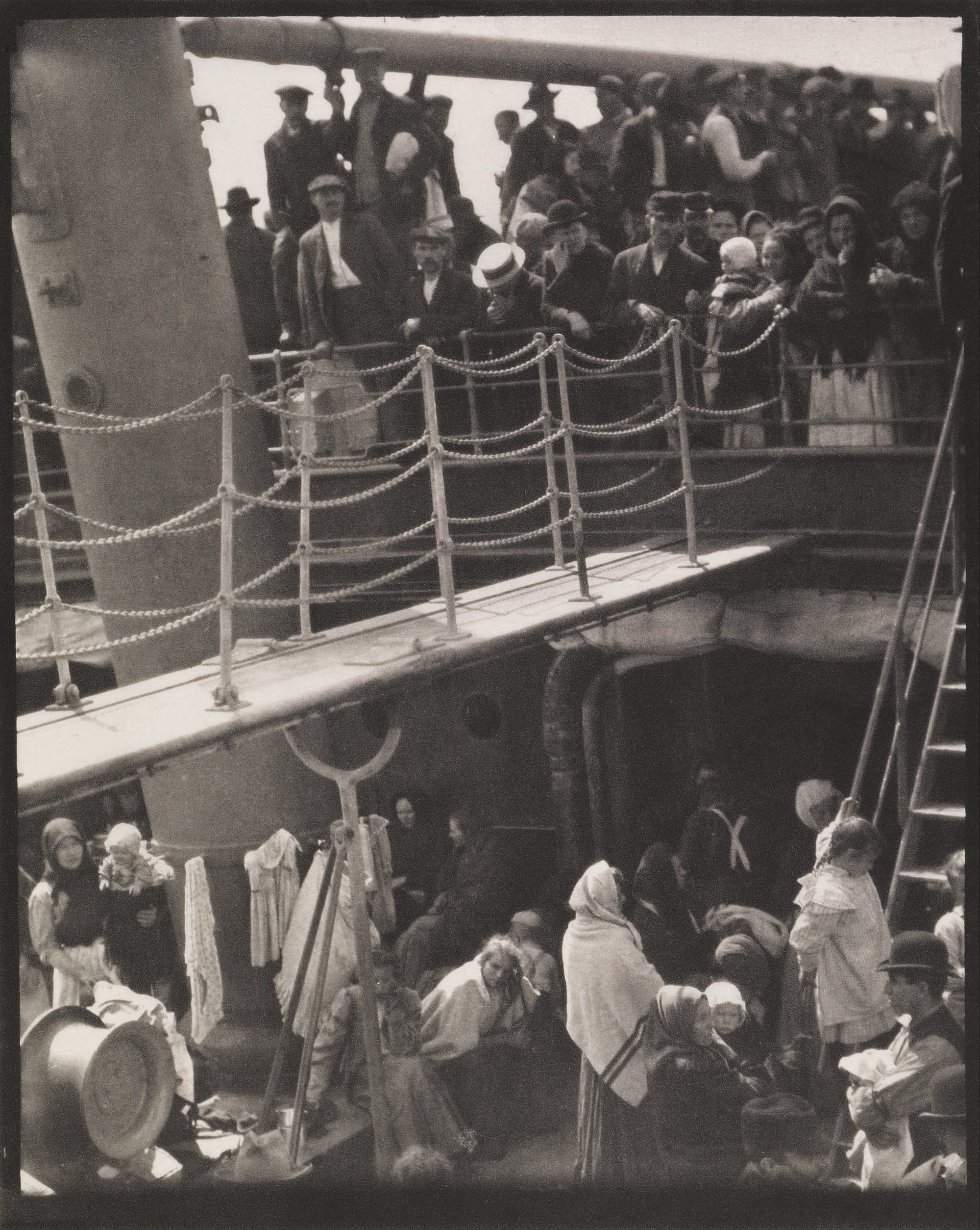 a black and white photo by Alfred Stieglitz of people on a split-level ship