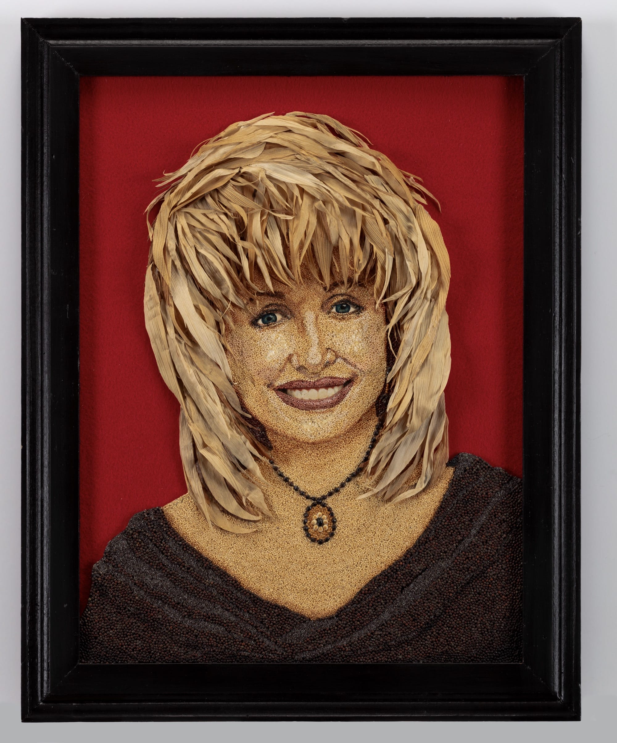 a seed art portrait of Dolly Parton